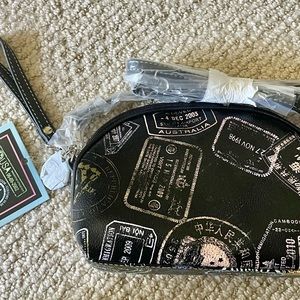 Black Mini bag, can be a wristlet or a crossbody bag. 9” wide by 6“ tall.